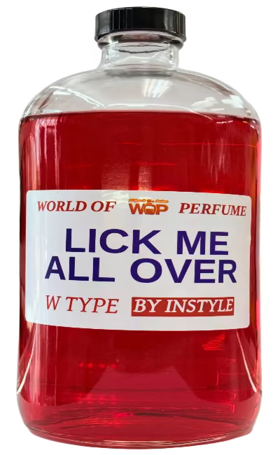 Bottle of red liquid with a label reading 'Lick Me All Over' on a white background